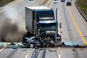 Highway accident between a big truk and car