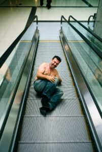 Injured man on escalator