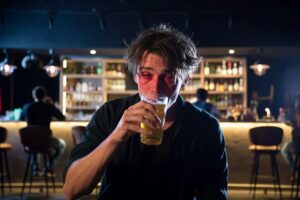 Drunk man at a bar