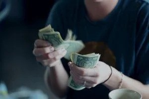 Woman counting money.