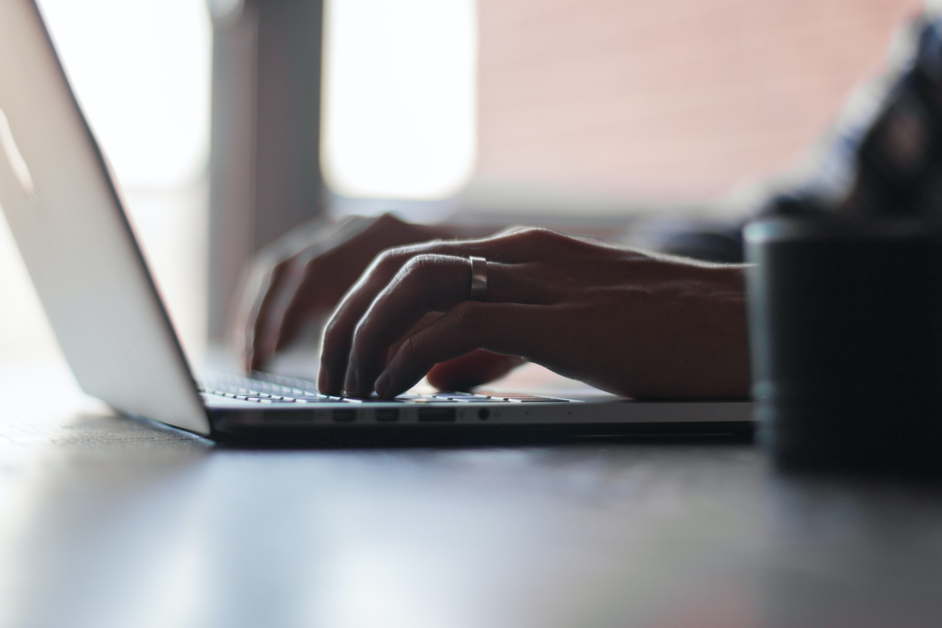 A person using lap top.