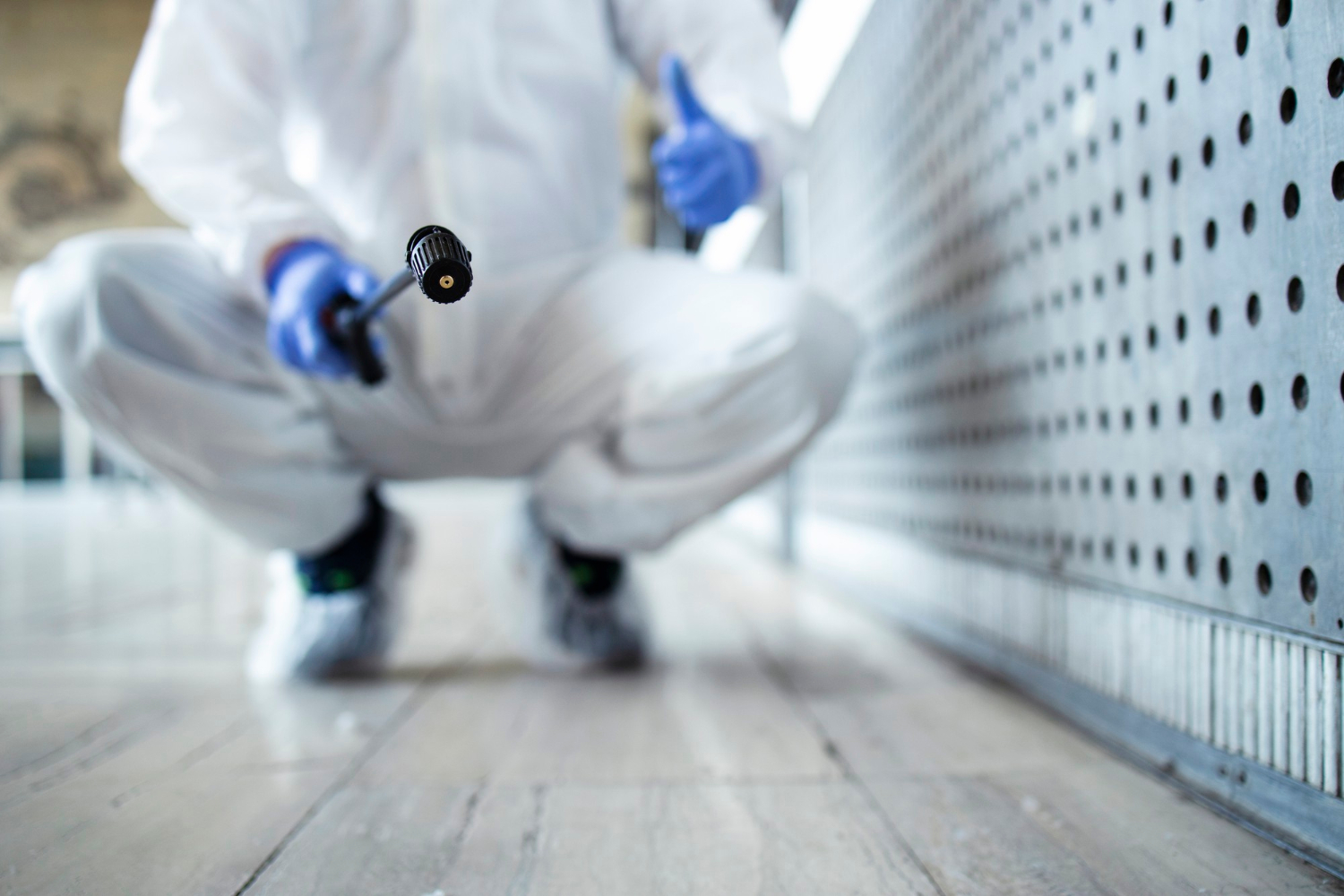 Man in white protection suit.