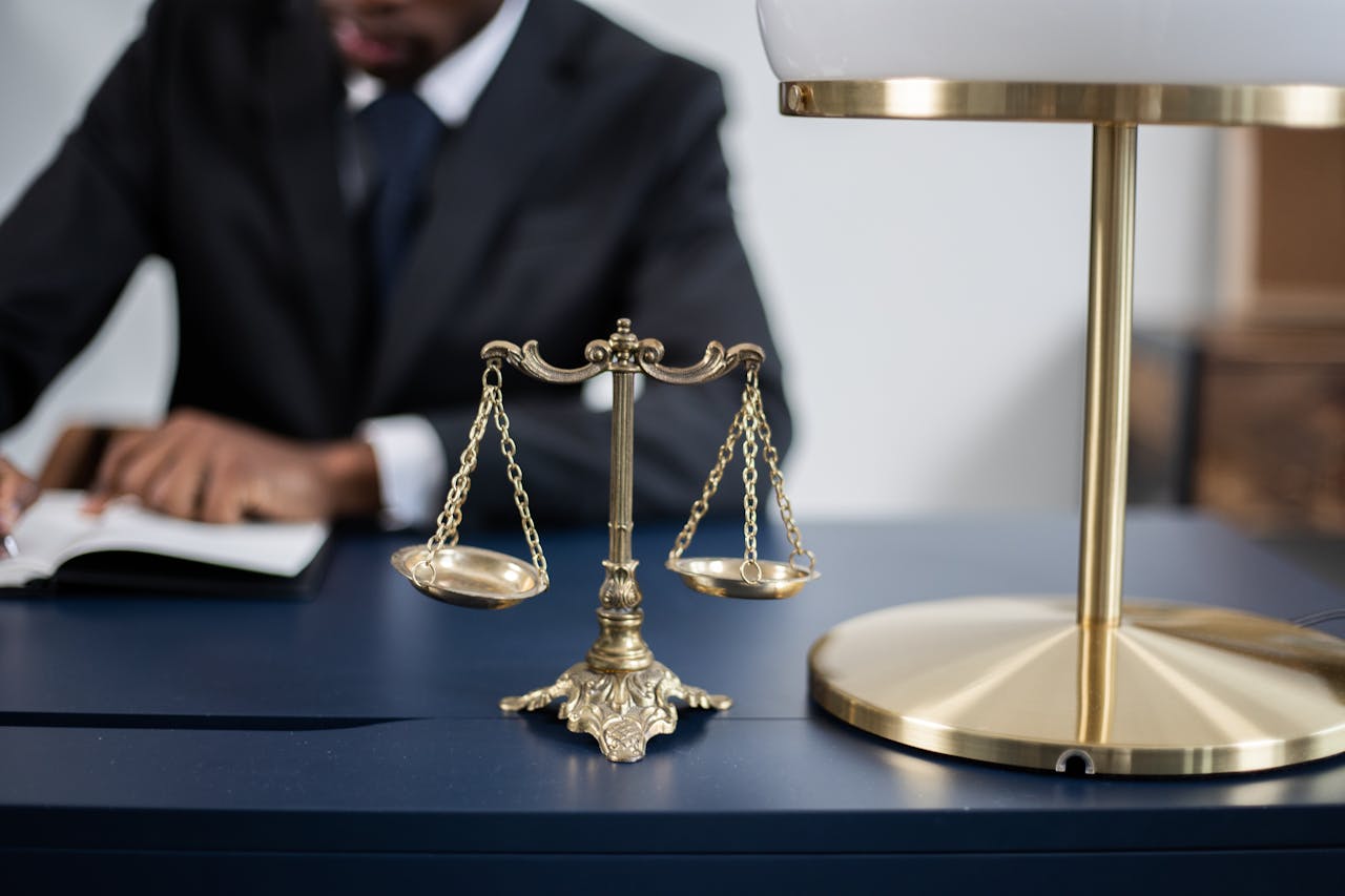 A balance scale on a table, the symbol of justice